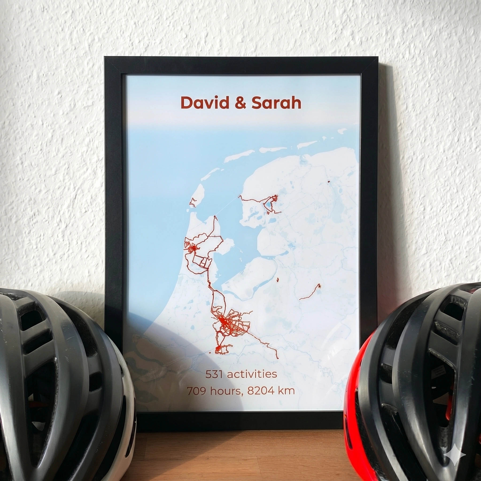 Framed Together Mode poster with David & Sarah, shared cycling kilometres on one map